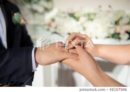 Groom at bridal wedding, exchange of bridal ring Groom at bridal wedding, exchange of bridal ring 48107986