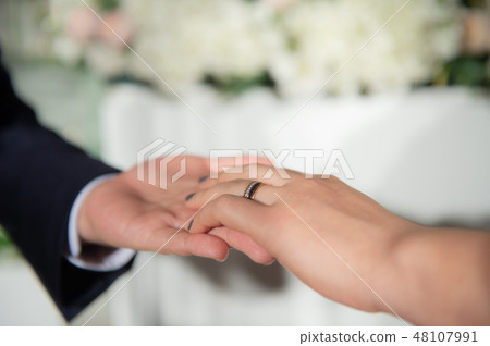 Groom at bridal wedding, exchange of bridal ring 48107991