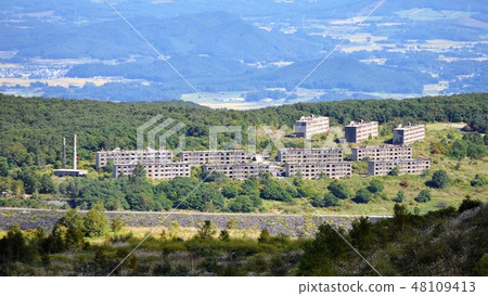Former Matsuo mine green lodge apartment ruins distant view 48109413