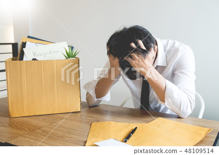 Businessmen are holding resignation document and packing persona 48109514
