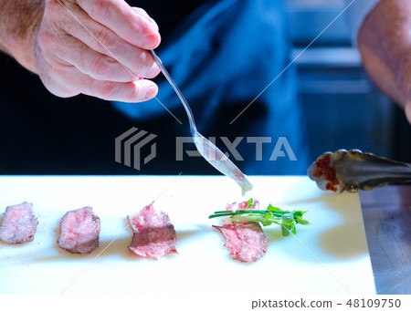 Chef cooking, Chef preparing food in the kitchen Chef cooking, Chef preparing food in the kitchen 48109750