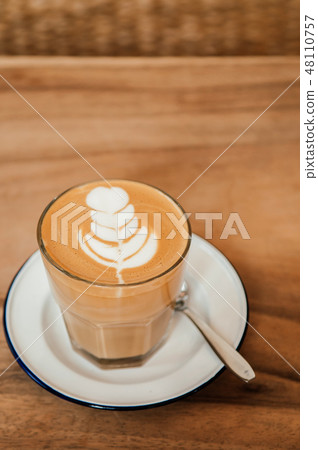 Nice cups of hot Coffee Latte art on wood table Nice cups of hot Coffee Latte art on wood table 48110757