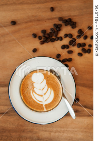 Nice cups of hot Coffee Latte on wood table Nice cups of hot Coffee Latte on wood table 48110760