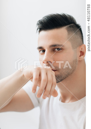 Handsome thoughtful man portrait Handsome thoughtful man portrait 48110788