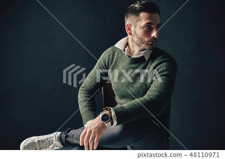 Stylish handsome man portrait on dark background Stylish handsome man portrait on dark background 48110971