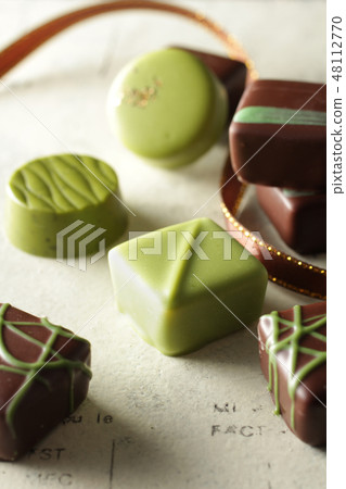 Various shapes of green chocolate Various shapes of green chocolate 48112770