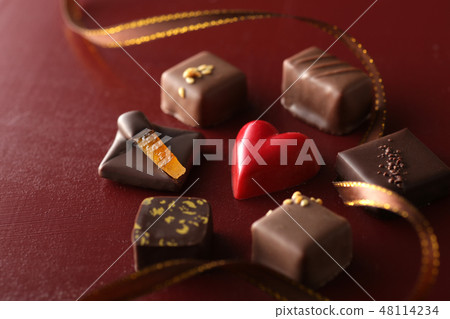 Group photo of chocolate with red heart shaped chocolate 48114234