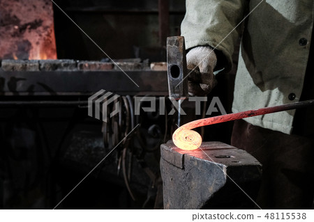 Forge, production workshop. Blacksmith tools and hot metal. Forge, production workshop. Blacksmith tools and hot metal. 48115538