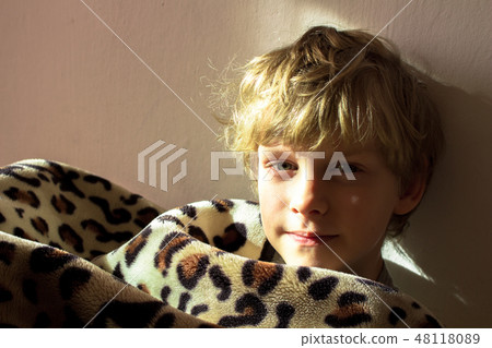child boy wrapped in a blanket 48118089