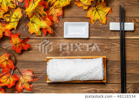 Wooden table with chopsticks, towel 48118334