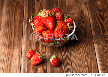 Fresh strawberries on wooden table Fresh strawberries on wooden table 48118484