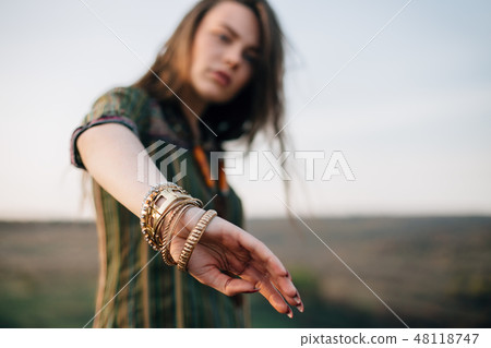 Boho woman portrait. Focus on bracelets Boho woman portrait. Focus on bracelets 48118747