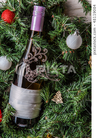 Photo of spruce branches with bottle of wine, blank greeting card 48119084
