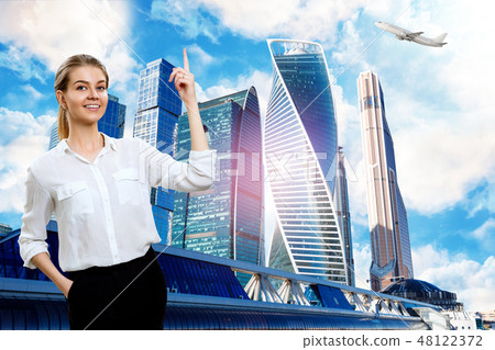 Young business woman raises forefinger up. 48122372