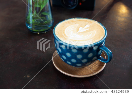 Hot latte coffee on wooden table in cafe 48124989