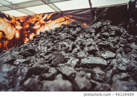 Heap of coal. place where coal stored for selling. 48126489