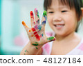 Kid painting with colorful art work 48127184