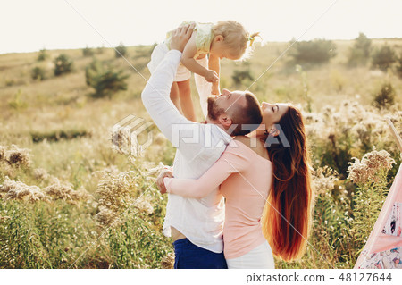 Family have fun in a park Family have fun in a park 48127644