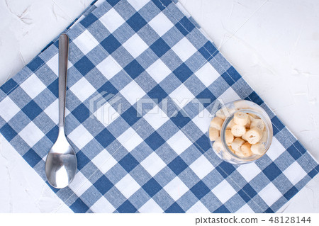Napkin dining room with blue cage and tableware on the table. Table setting. Free space for text. 48128144