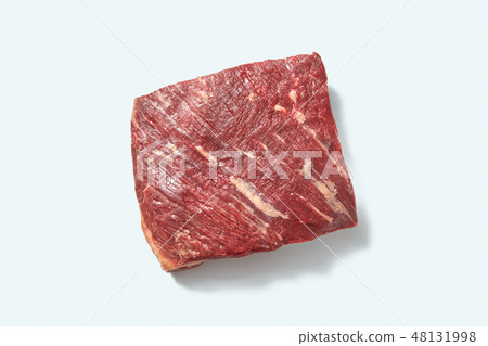 Fresh organic raw meat for roasting with shadows on a white background, copy space. Flat lay Fresh organic raw meat for roasting with shadows on a white background, copy space. Flat lay 48131998