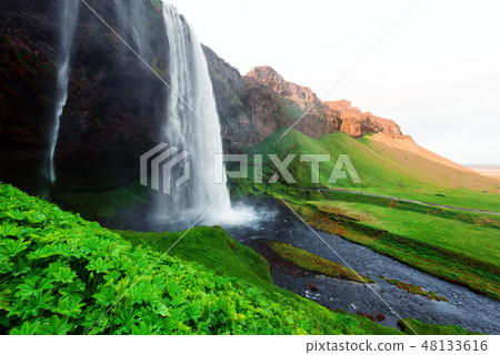 Sunrise on Seljalandfoss waterfall 48133616