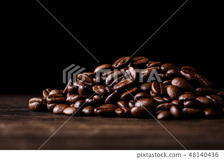 Up of coffee beans on black background 48140436