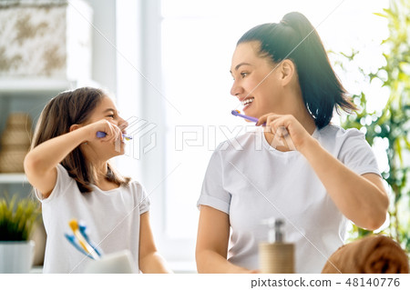 family are brushing teeth 48140776