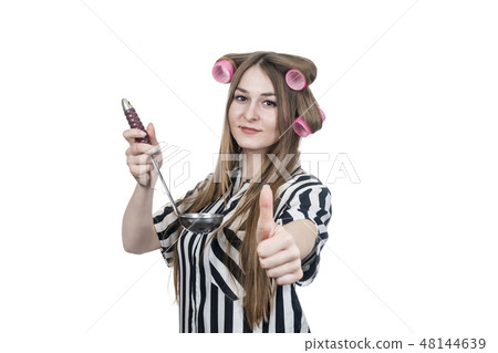 business woman with a ladle in curlers 48144639