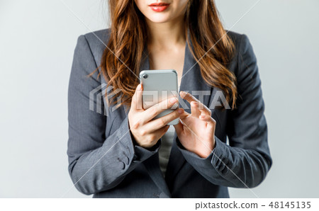 Woman holding a smartphone 48145135