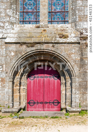 Red entrance archway to the church of Saint-Suliac Red entrance archway to the church of Saint-Suliac 48146353