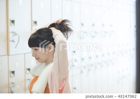 Sports club changing room young lady Sports club changing room young lady 48147062