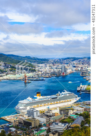 A view of a passenger ship and Nagasaki Port from Mt. Nabekan [Nagasaki City, Nagasaki Prefecture] 48147311