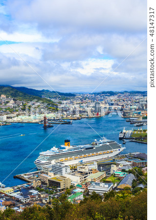 A view of a passenger ship and Nagasaki Port from Mt. Nabekan [Nagasaki City, Nagasaki Prefecture] 48147317