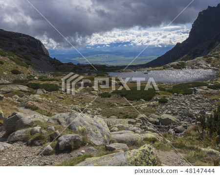 Valley Mlynska Dolina in slovakia mountains with view on Strbske pleso village and mountain lake 48147444