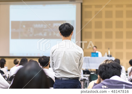 Seminar Q&A session with a participant rear view Seminar Q&A session with a participant rear view 48147816