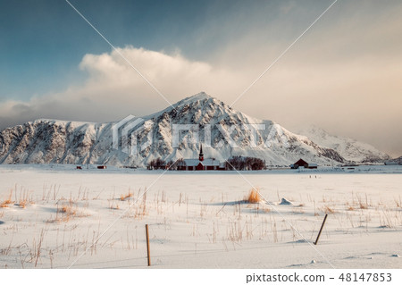 The red Parish church with mountain in snowy The red Parish church with mountain in snowy 48147853
