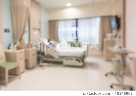 Patient on hospital bed medical blur interior view 48148961