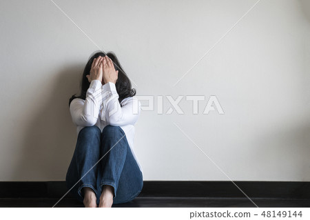 Stressful woman sitting sadly emotional depression 48149144