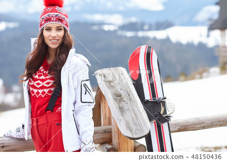 sexy woman with snowboard outdoors 48150436