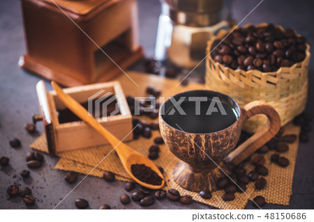 Brew black coffee in coconut cup and morning light Brew black coffee in coconut cup and morning light 48150686