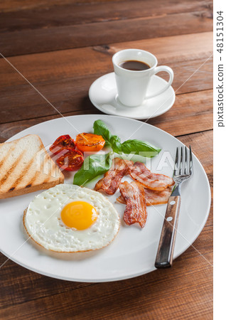 Fried eggs with bacon on breakfast Fried eggs with bacon on breakfast 48151304