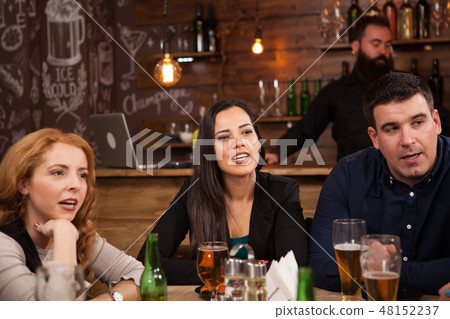 Old friends having fun in an old styled pub 48152237