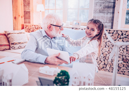 Young lady showing grandfather how taking picture at phone Young lady showing grandfather how taking picture at phone 48155125