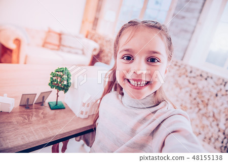 Happy child taking selfie with her project Happy child taking selfie with her project 48155138