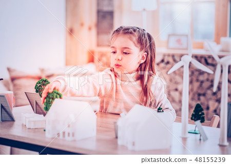 Schoolgirl making eco project for future lesson Schoolgirl making eco project for future lesson 48155239
