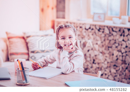 Small beautiful girl doing fantastic sketch by pencil at album Small beautiful girl doing fantastic sketch by pencil at album 48155282