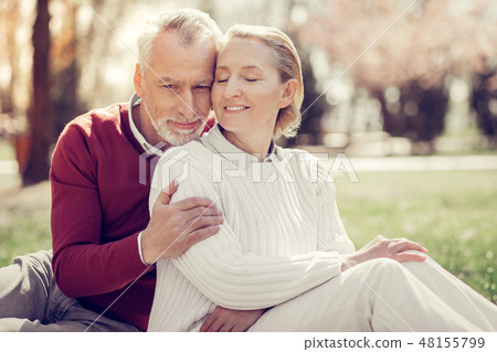 Tender blonde female person sitting near her husband 48155799