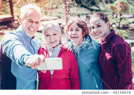 Bearded retired man making selfie with his sport group 48156678