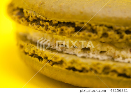 Close up big macaroon coconut flavour on yellow background 48156881