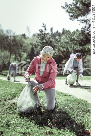 Thoughtful old nice grandma thinking about environment 48157804